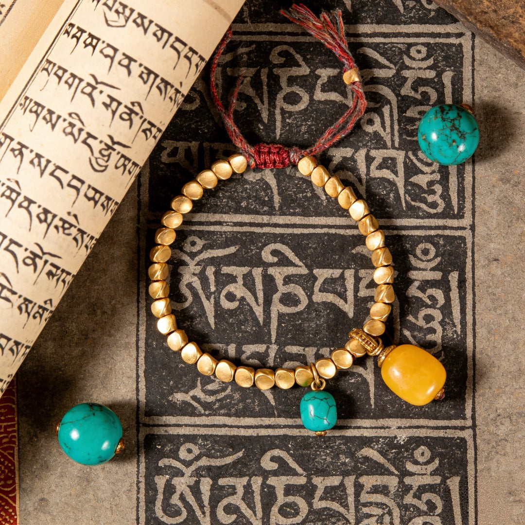 Tibetan Vajra brass red string bracelet prosperity protection handcrafted — flatlay front view | BuddhaManifest™