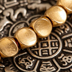 Tibetan Vajra brass red string bracelet prosperity protection handcrafted — stack styling shot | BuddhaManifest™