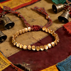 Tibetan Vajra brass red string bracelet prosperity protection handcrafted — close-up hardware | BuddhaManifest™
