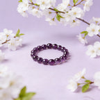 Amethyst healing crystal bracelet calm clarity purple stone jewelry — macro stone texture | BuddhaManifest™