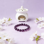 Amethyst healing crystal bracelet calm clarity purple stone jewelry — flatlay front view | BuddhaManifest™