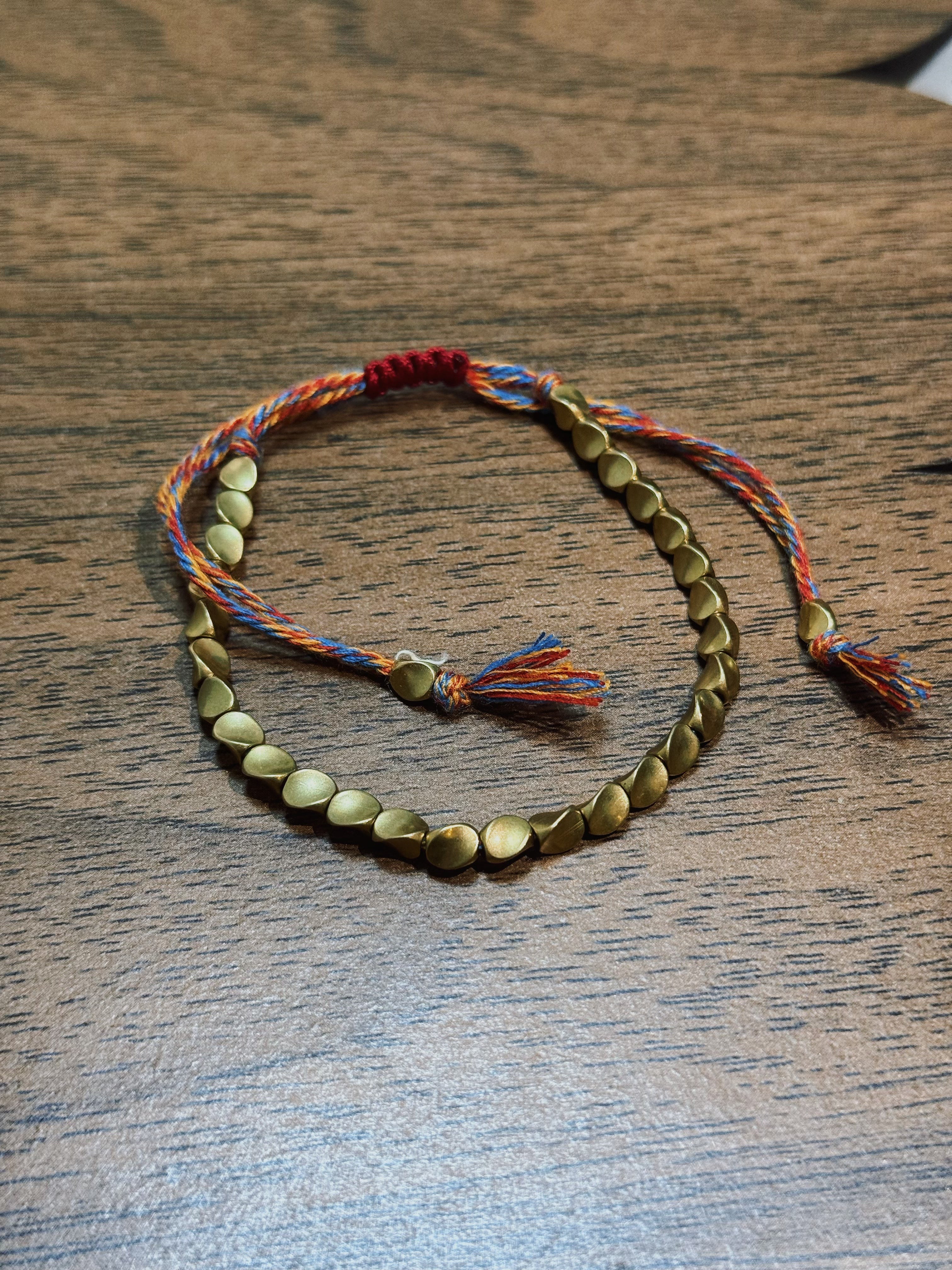 Tibetan Vajra brass red string bracelet prosperity protection handcrafted — on-wrist lifestyle | BuddhaManifest™