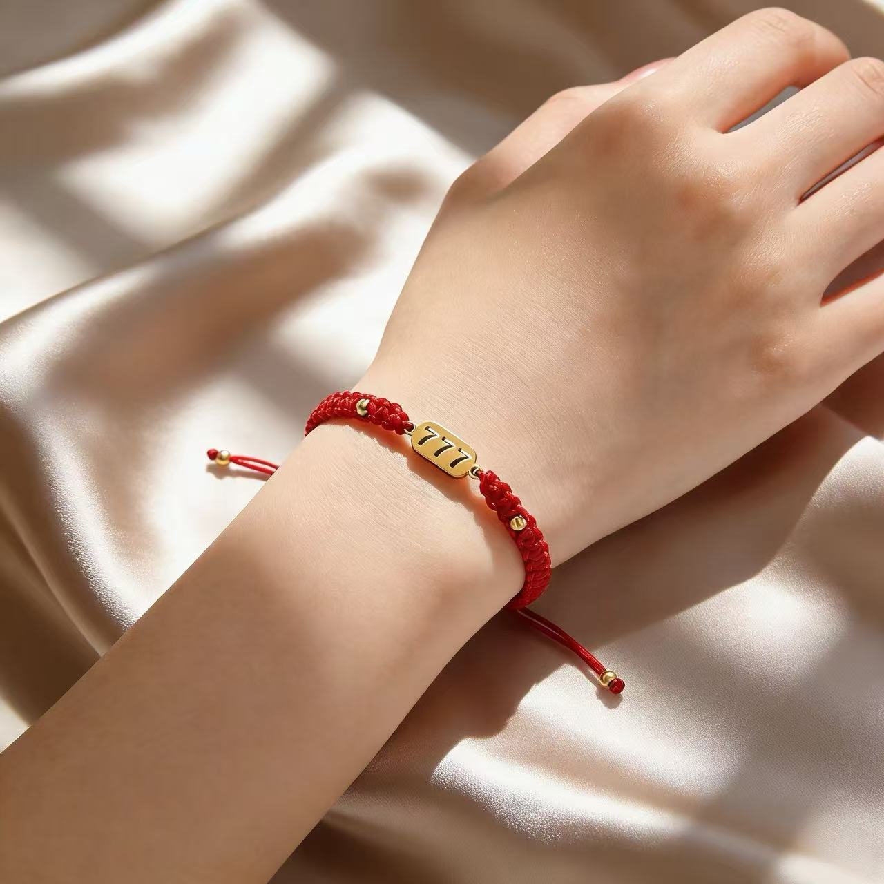 777 angel number red string bracelet alignment spiritual luck sacred cord — macro stone texture | BuddhaManifest™