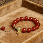 Red agate nephrite jade vitality protection stretch intention bracelet — macro stone texture | BuddhaManifest™