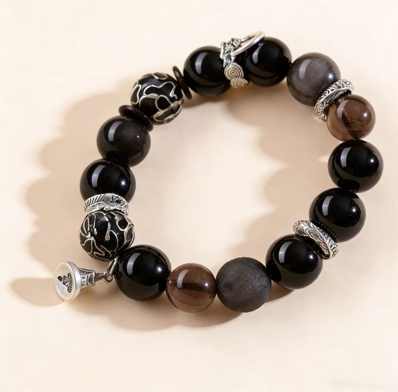 Obsidian thunder-struck wood protection bracelet grounding talisman jewelry — stack styling shot | BuddhaManifest™