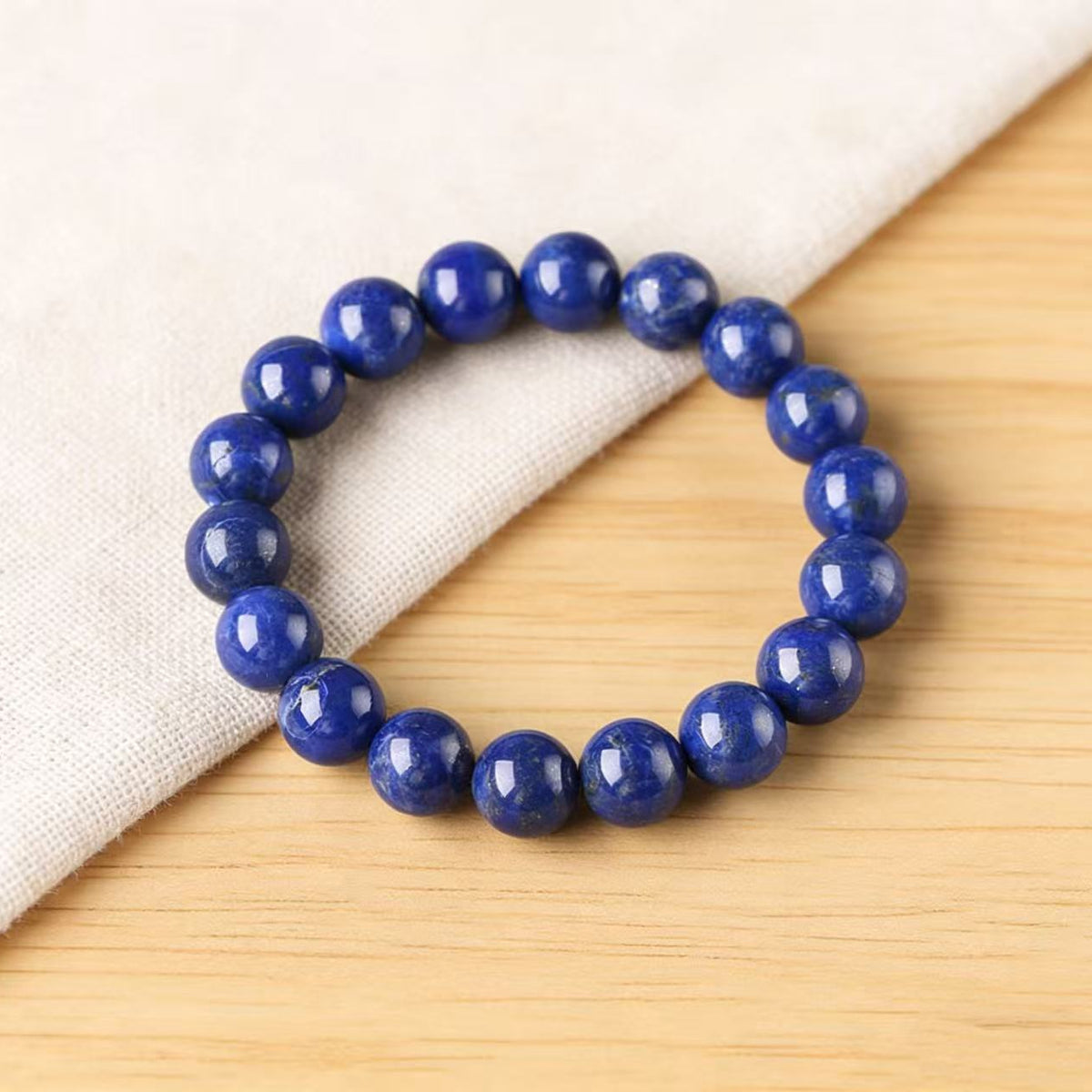 Royal lapis lazuli wisdom bracelet healing crystal deep blue jewelry — flatlay front view | BuddhaManifest™ Main image