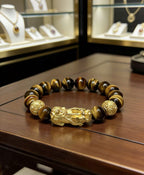 Golden tiger eye Pixiu wealth bracelet Feng Shui abundance courage jewelry — on-wrist lifestyle | BuddhaManifest™