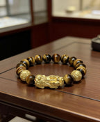 Golden tiger eye Pixiu wealth bracelet Feng Shui abundance courage jewelry — bead & charm detail | BuddhaManifest™