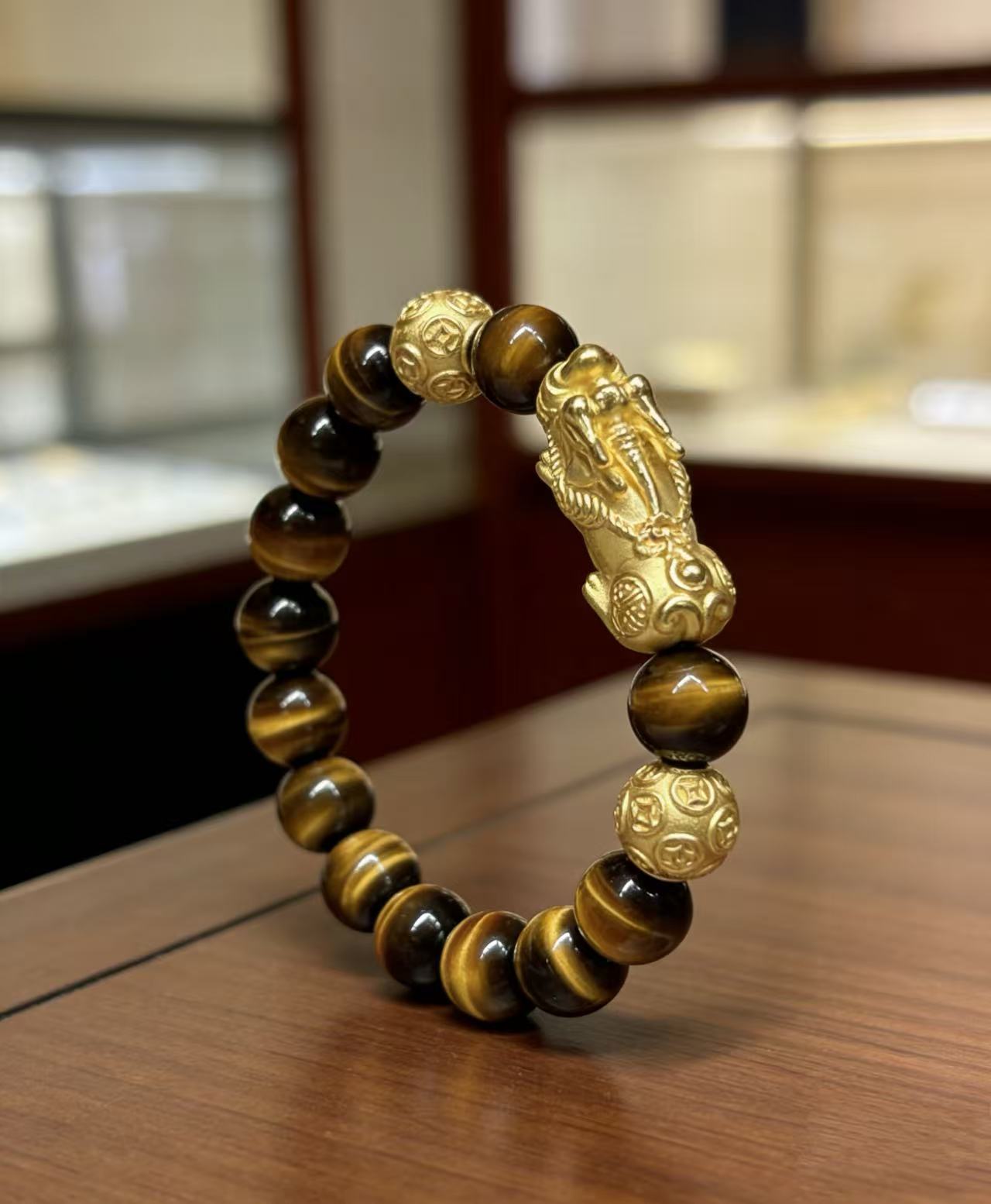 Golden tiger eye Pixiu wealth bracelet Feng Shui abundance courage jewelry — side angle product | BuddhaManifest™