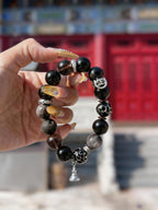 Obsidian thunder-struck wood protection bracelet grounding talisman jewelry — close-up hardware | BuddhaManifest™