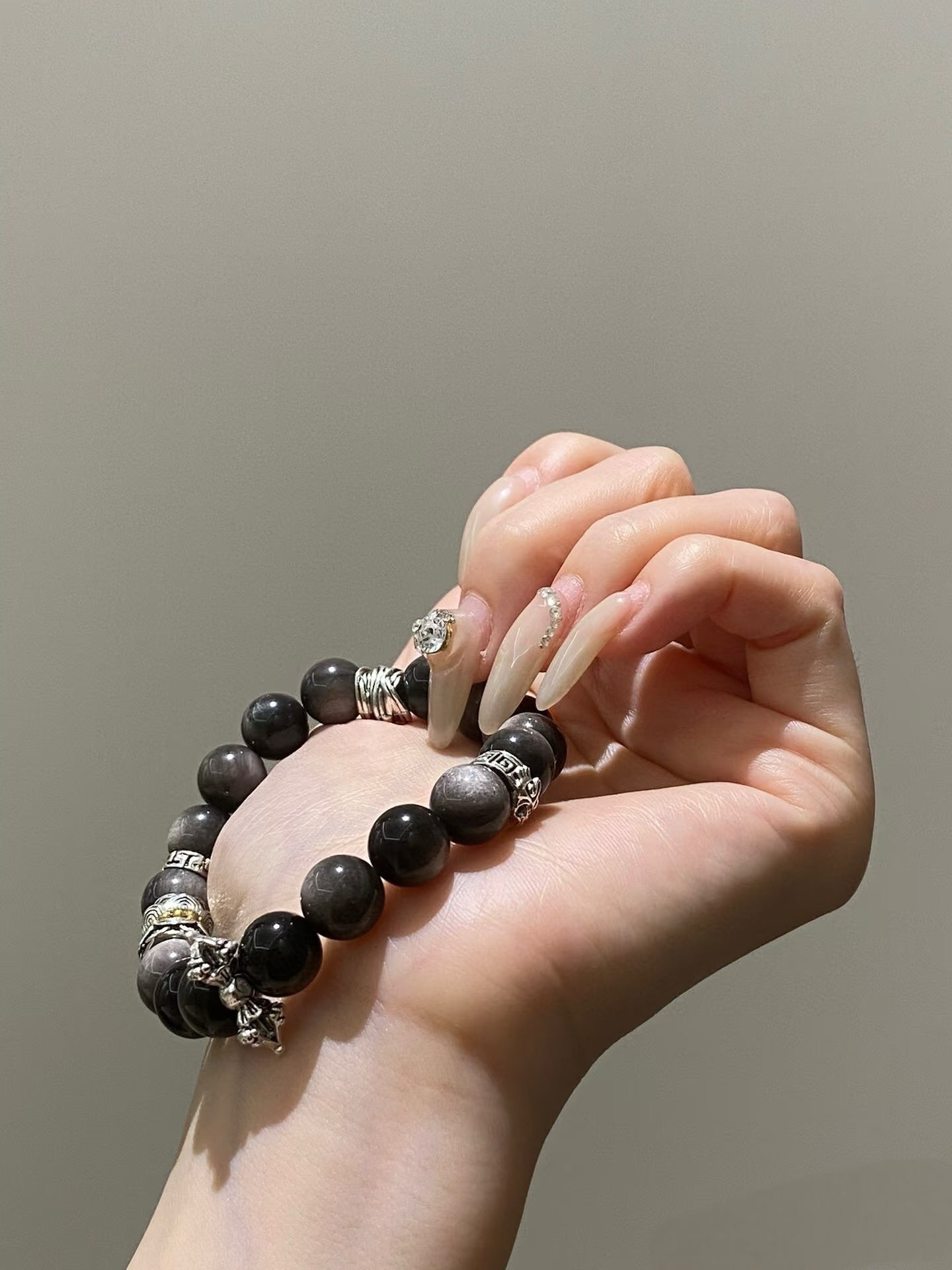Obsidian thunder-struck wood protection bracelet grounding talisman jewelry — flatlay front view | BuddhaManifest™