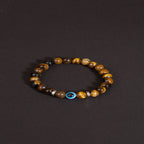 Golden tiger eye evil eye bracelet courage discernment protection — flatlay front view | BuddhaManifest™