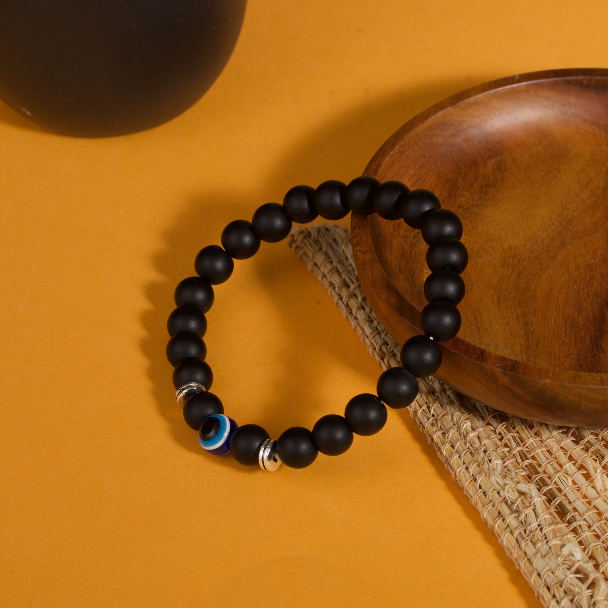 Black obsidian evil eye protection bracelet grounding boundary jewelry — flatlay front view | BuddhaManifest™