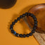 Frosted stone evil eye matte bracelet protection talisman jewelry — flatlay front view | BuddhaManifest™