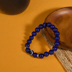Lapis lazuli evil eye bracelet intuition truth protection stone jewelry — flatlay front view | BuddhaManifest™