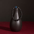 Frosted stone evil eye matte bracelet protection talisman jewelry — on-wrist lifestyle | BuddhaManifest™