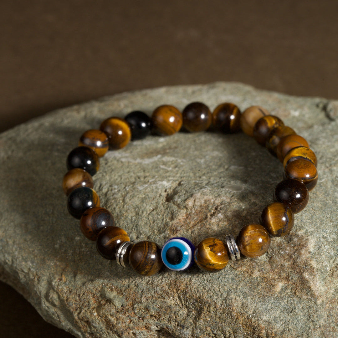 Golden tiger eye evil eye bracelet courage discernment protection — on-wrist lifestyle | BuddhaManifest™