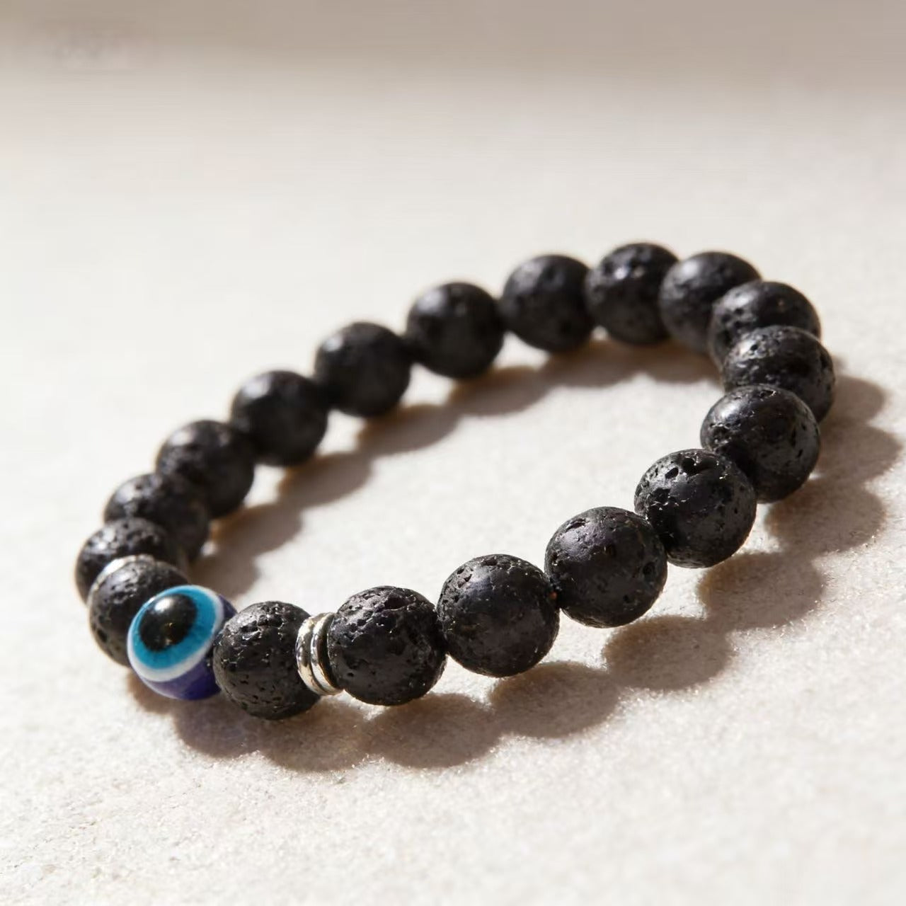 Frosted stone evil eye matte bracelet protection talisman jewelry — macro stone texture | BuddhaManifest™