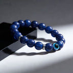 Lapis lazuli evil eye bracelet intuition truth protection stone jewelry — macro stone texture | BuddhaManifest™