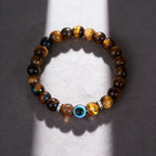 Golden tiger eye evil eye bracelet courage discernment protection — side angle product | BuddhaManifest™