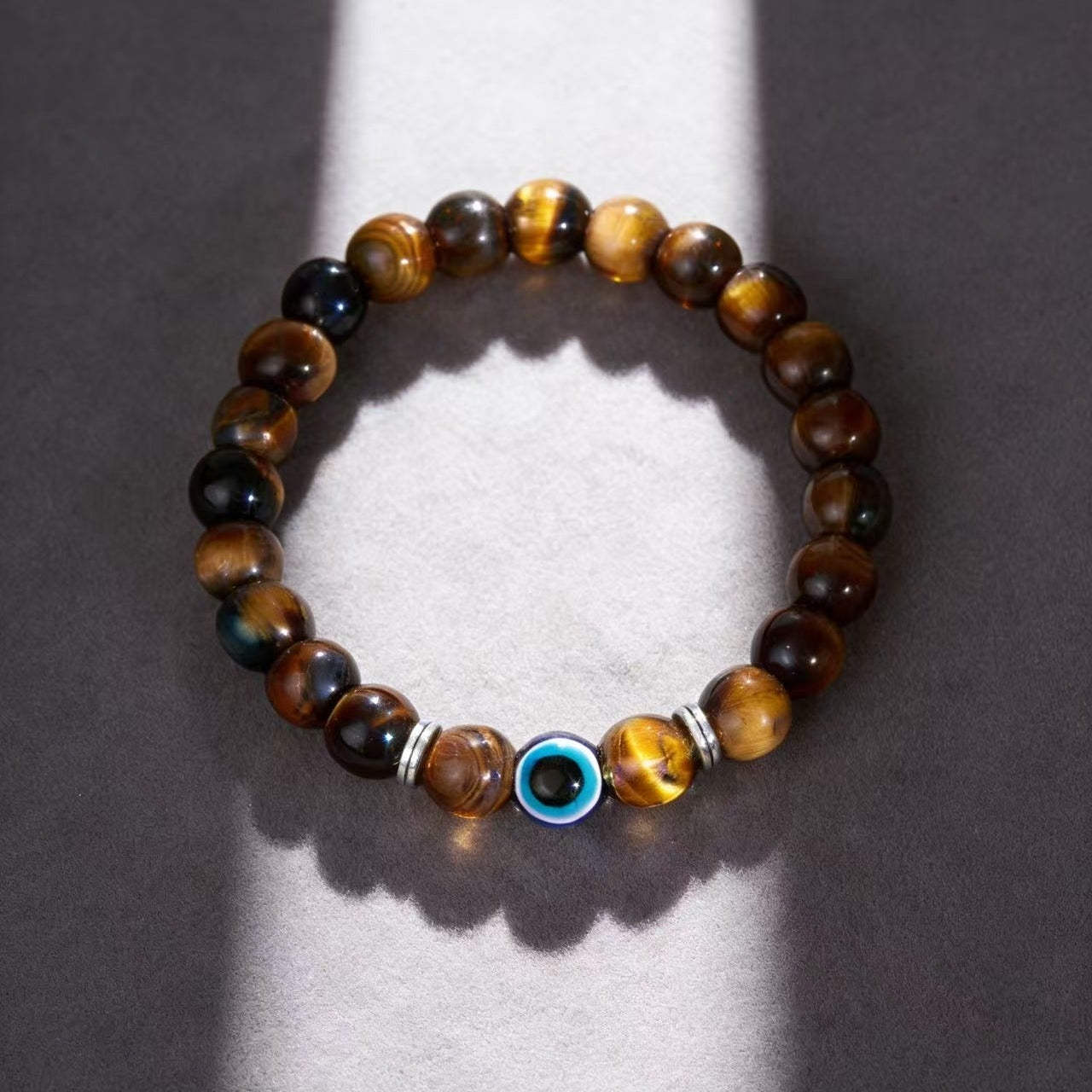Golden tiger eye evil eye bracelet courage discernment protection — side angle product | BuddhaManifest™