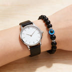 Black obsidian evil eye protection bracelet grounding boundary jewelry — macro stone texture | BuddhaManifest™