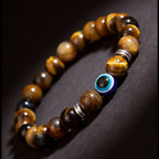 Golden tiger eye evil eye bracelet courage discernment protection — bead & charm detail | BuddhaManifest™