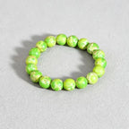 Imperial banded stone bracelet vitality noble energy spiritual stack — macro stone texture | BuddhaManifest™