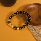 Black obsidian Pixiu Six True Words mantra wealth protection bracelet — flatlay front view | BuddhaManifest™