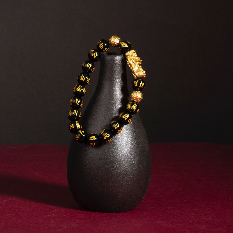 Black obsidian Pixiu Six True Words mantra wealth protection bracelet — flatlay front view | BuddhaManifest™ Main image