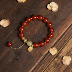 Red agate Fu charm fortune bracelet stretch intention jewelry gift — on-wrist lifestyle | BuddhaManifest™