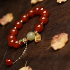 Red agate nephrite jade vitality protection stretch intention bracelet — stack styling shot | BuddhaManifest™