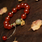 Red agate Fu charm fortune bracelet stretch intention jewelry gift — macro stone texture | BuddhaManifest™