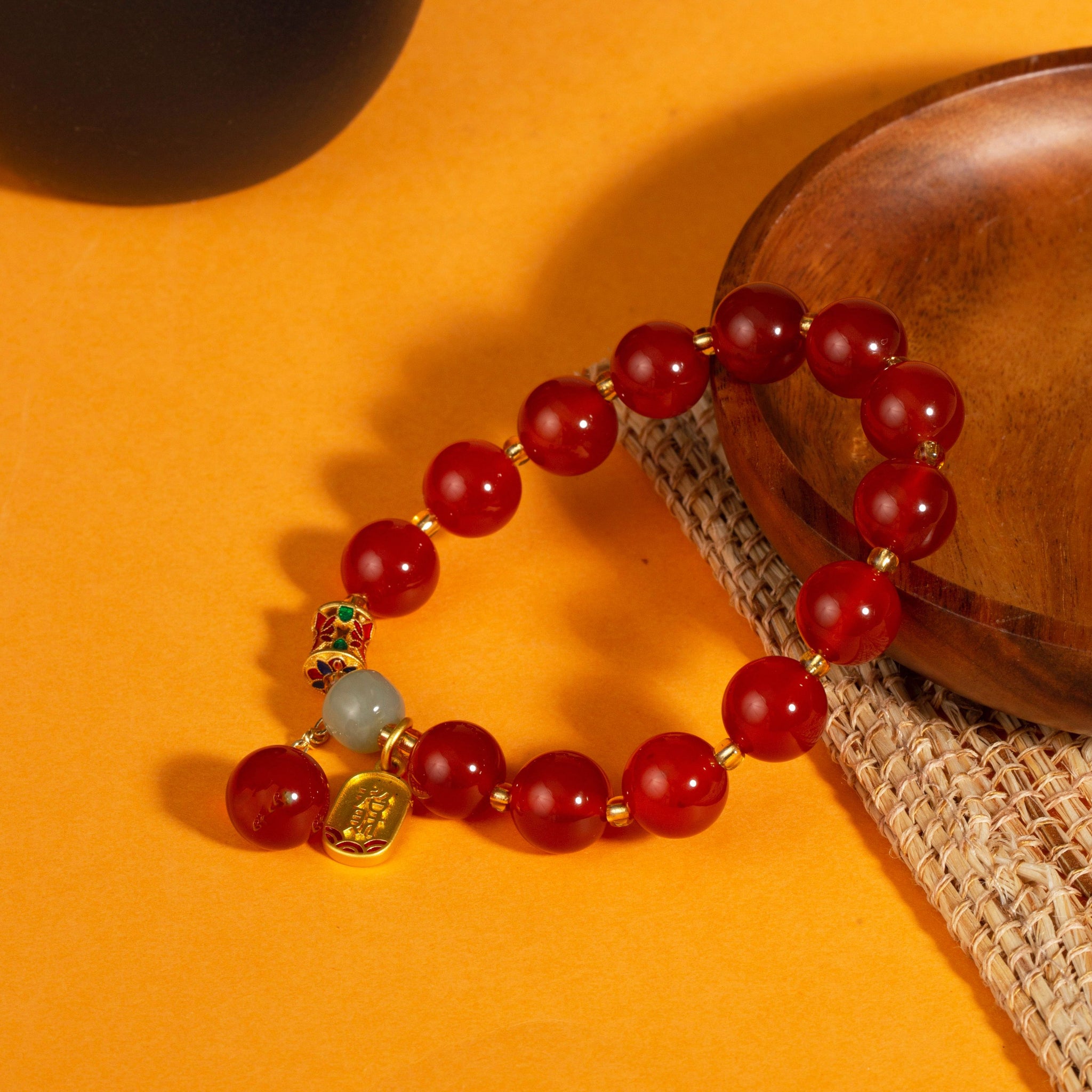 Red agate Fu charm fortune bracelet stretch intention jewelry gift — flatlay front view | BuddhaManifest™