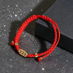 222 angel number red string bracelet balance harmony sacred cord — macro stone texture | BuddhaManifest™