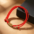 222 angel number red string bracelet balance harmony sacred cord — flatlay front view | BuddhaManifest™