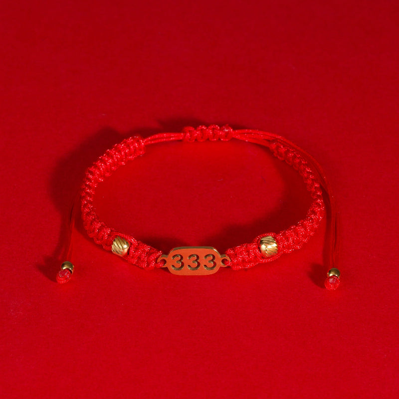 333 angel number red string bracelet support growth intention cord — flatlay front view | BuddhaManifest™ Main image