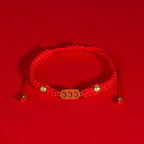 333 angel number red string bracelet support growth intention cord — flatlay front view | BuddhaManifest™