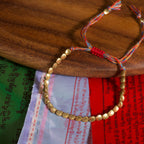 Tibetan Vajra brass red string bracelet prosperity protection handcrafted — bead & charm detail | BuddhaManifest™