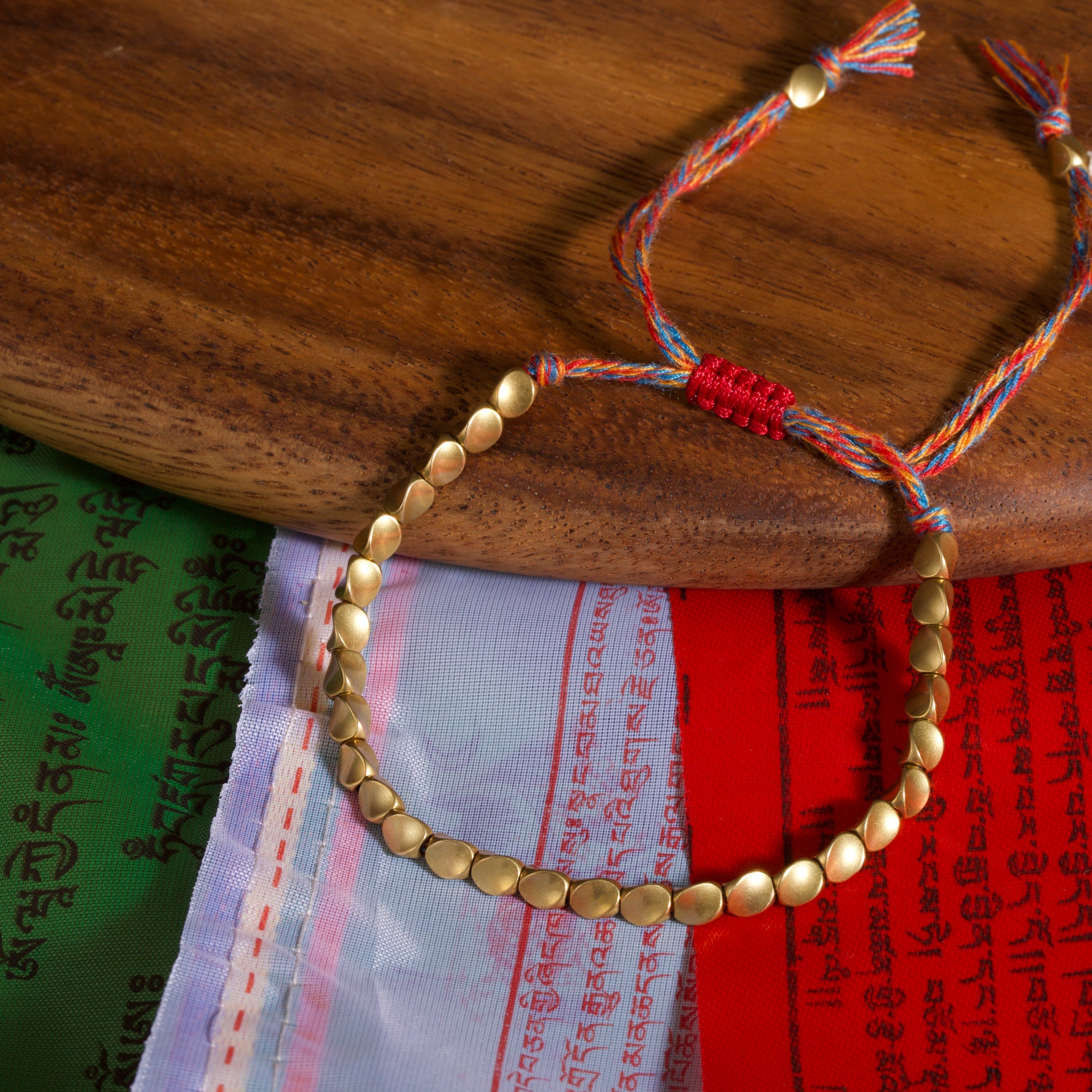 Tibetan Vajra brass red string bracelet prosperity protection handcrafted — bead & charm detail | BuddhaManifest™