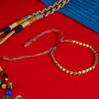 Tibetan Vajra brass red string bracelet prosperity protection handcrafted — on-wrist lifestyle | BuddhaManifest™