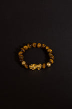 Golden tiger eye Pixiu wealth bracelet Feng Shui abundance courage jewelry — on-wrist lifestyle | BuddhaManifest™