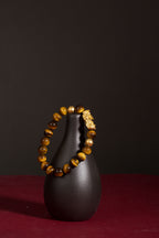 Golden tiger eye Pixiu wealth bracelet Feng Shui abundance courage jewelry — macro stone texture | BuddhaManifest™