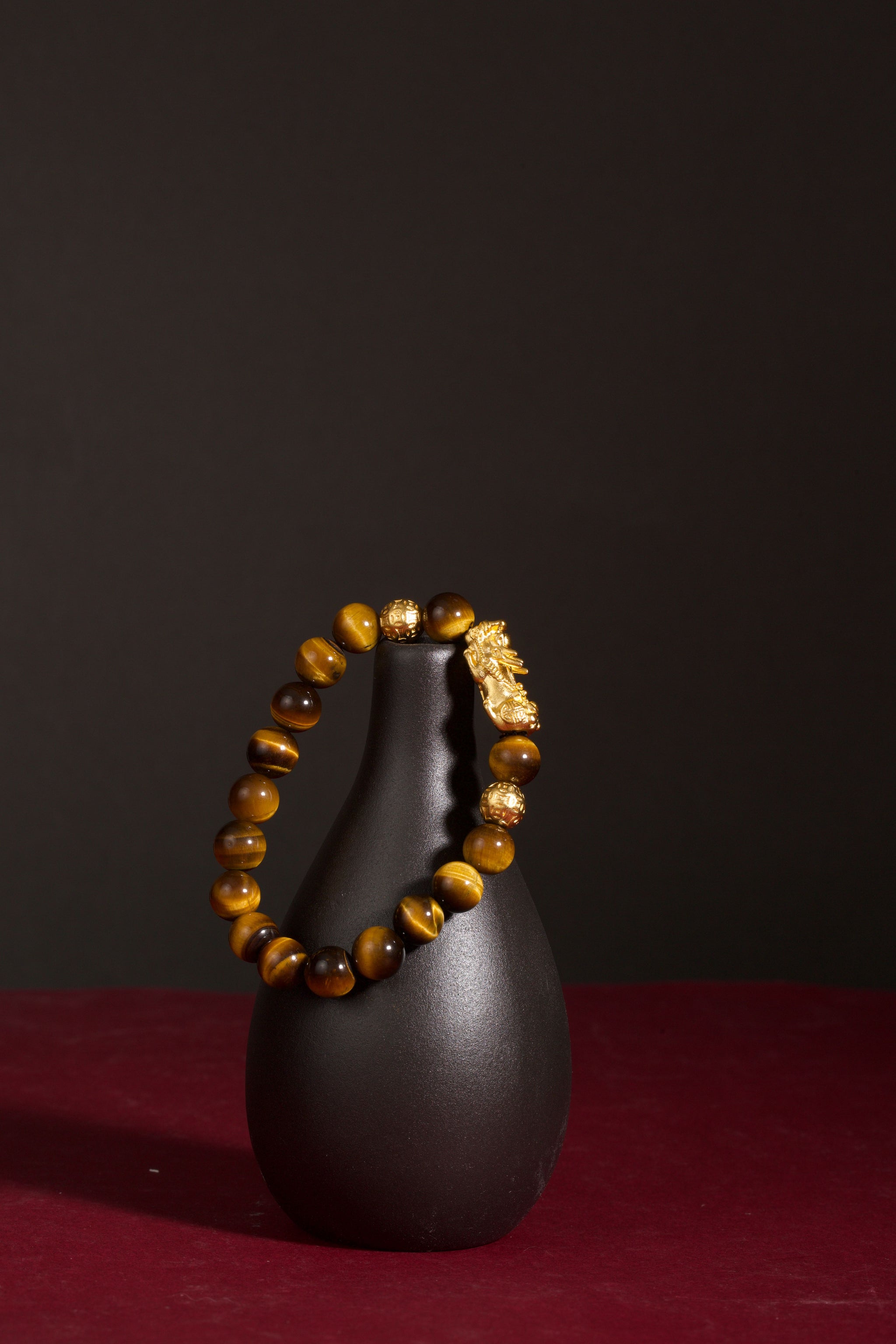 Golden tiger eye Pixiu wealth bracelet Feng Shui abundance courage jewelry — macro stone texture | BuddhaManifest™