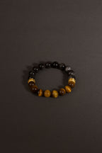 Yellow tiger eye obsidian bracelet Feng Shui courage insight protection — stack styling shot | BuddhaManifest™