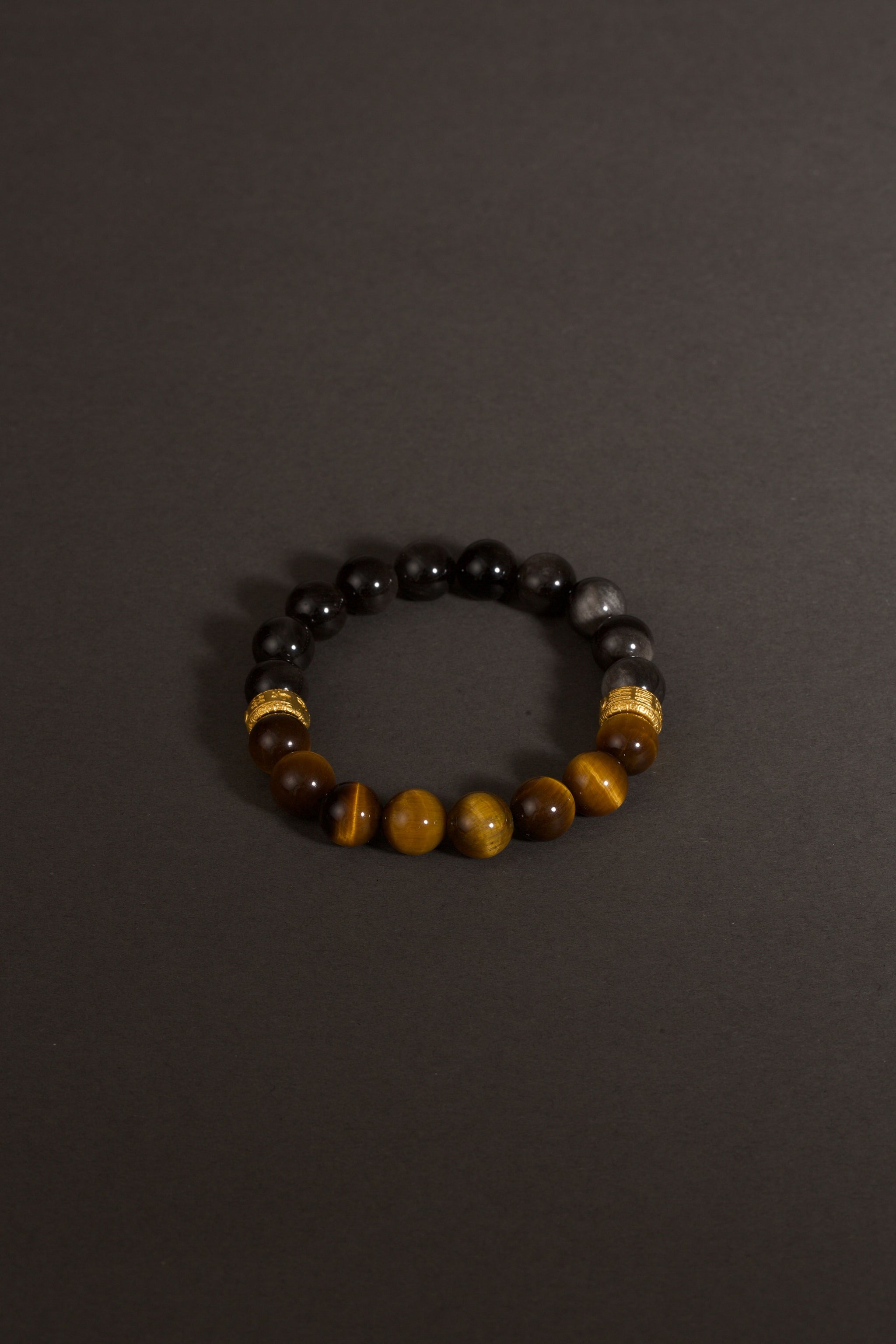 Yellow tiger eye obsidian bracelet Feng Shui courage insight protection — stack styling shot | BuddhaManifest™