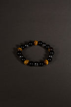 Triple protection tiger eye obsidian hematite bracelet courage shield — side angle product | BuddhaManifest™