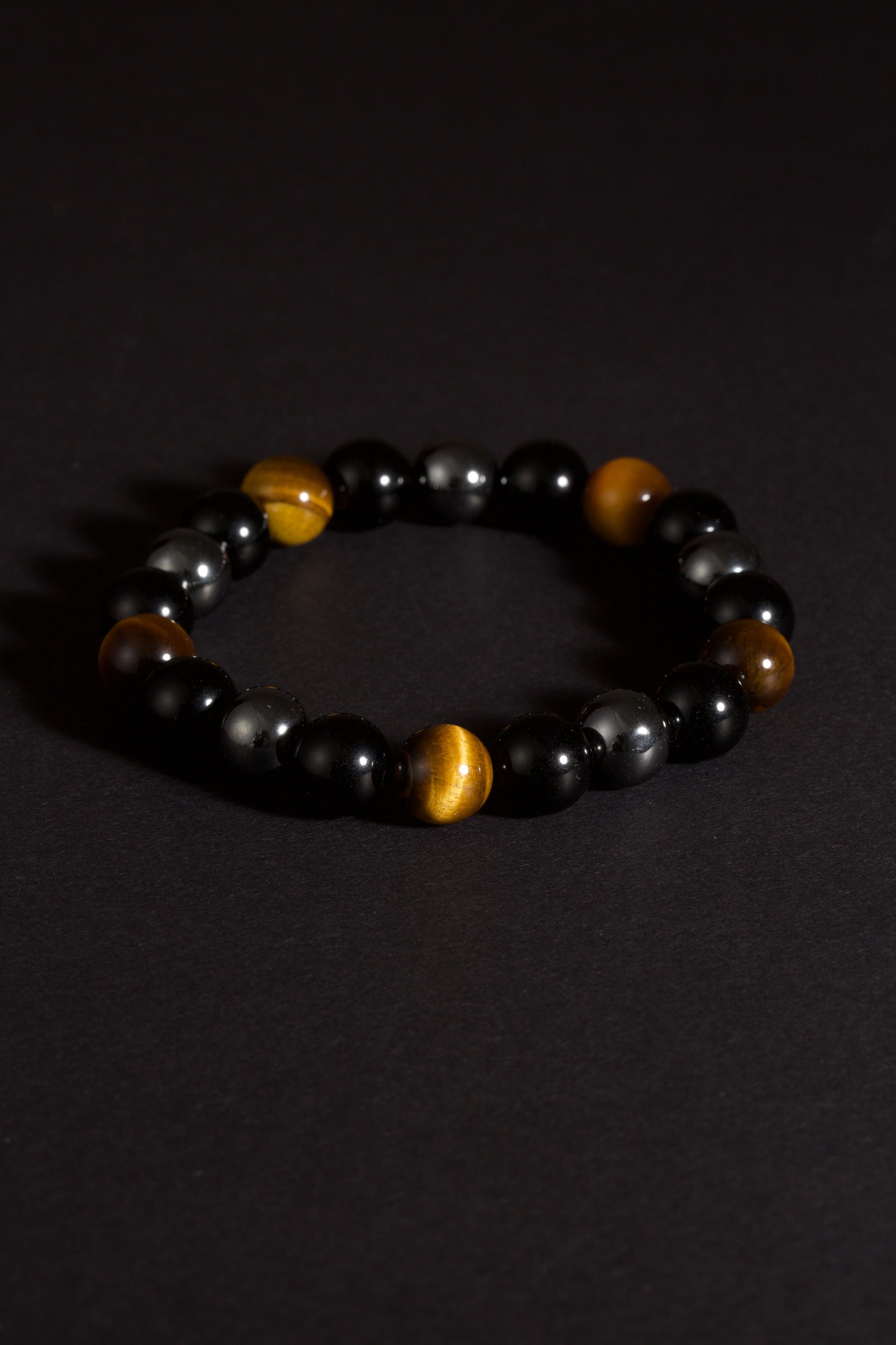 Triple protection tiger eye obsidian hematite bracelet courage shield — stack styling shot | BuddhaManifest™