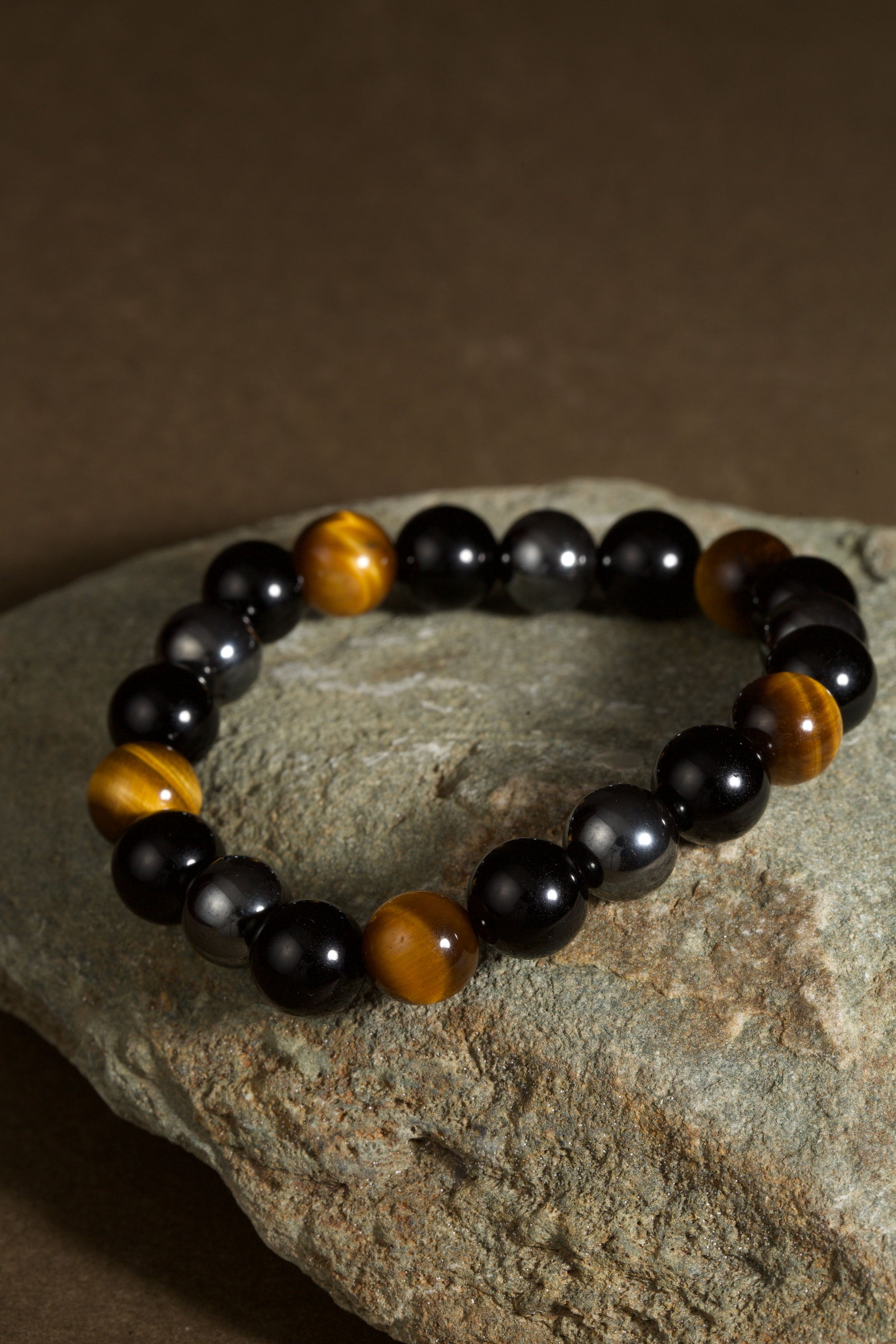 Triple protection tiger eye obsidian hematite bracelet courage shield — flatlay front view | BuddhaManifest™