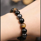 Obsidian tiger eye magnetite triple protection bracelet spiritual jewelry — side angle product | BuddhaManifest™